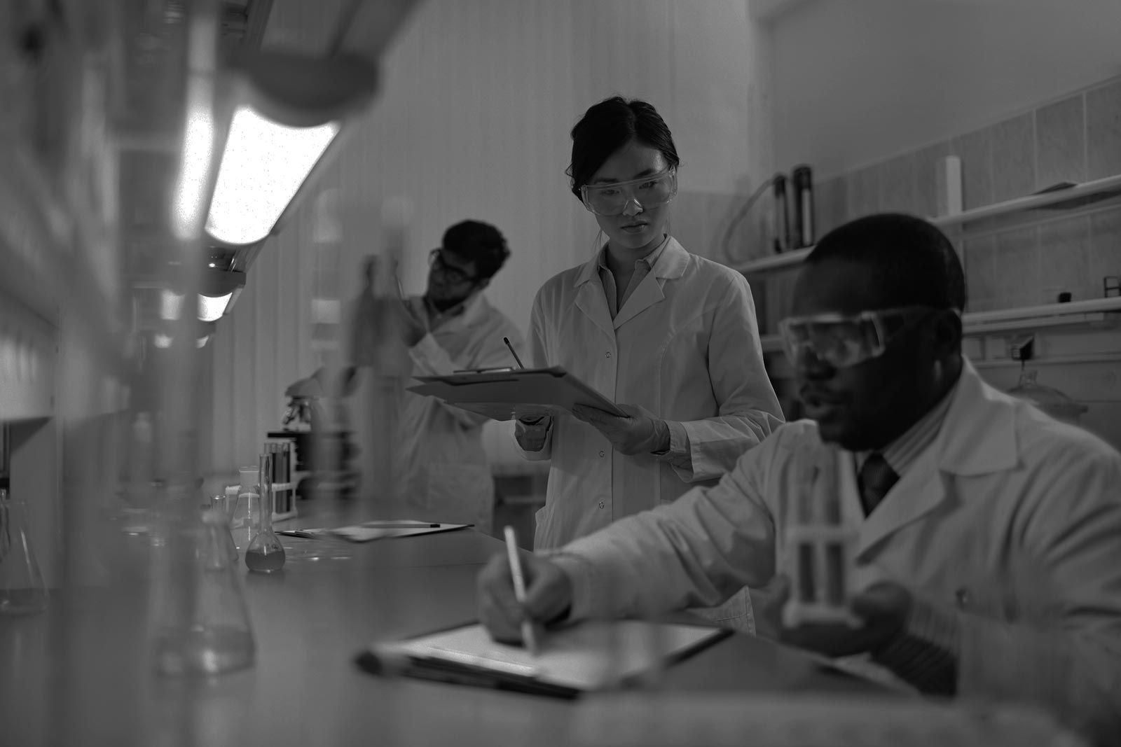 Young scientists analyzing substances in laboratory